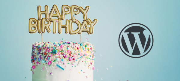Birthday cake with WordPress logo beside it